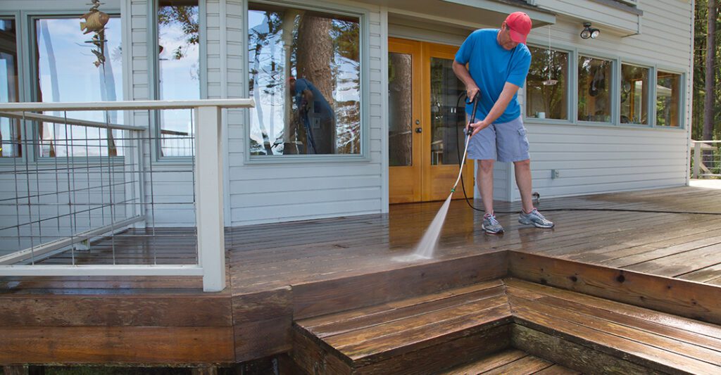 man washing his deck